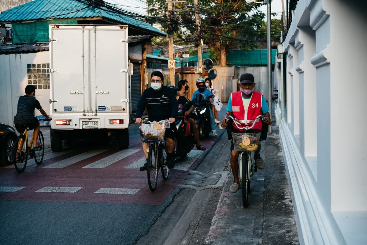 A busy city street with cyclists and traffic